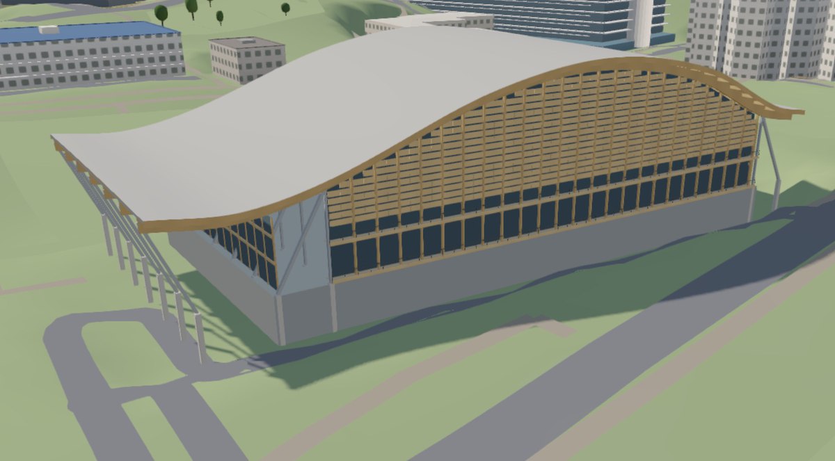 The same sports hall rebuilt in the 3D map, matching its curved roofline