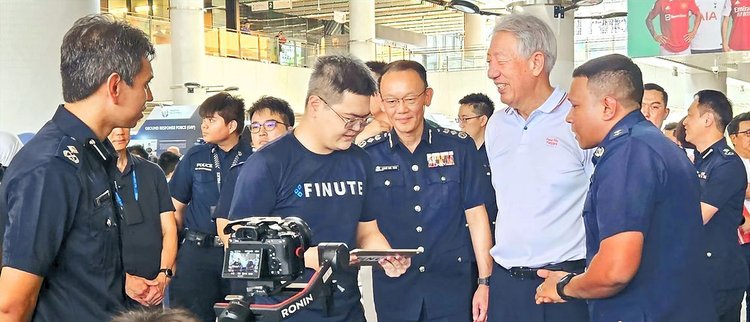 Finute team with Commissioner of Police and Senior Minister