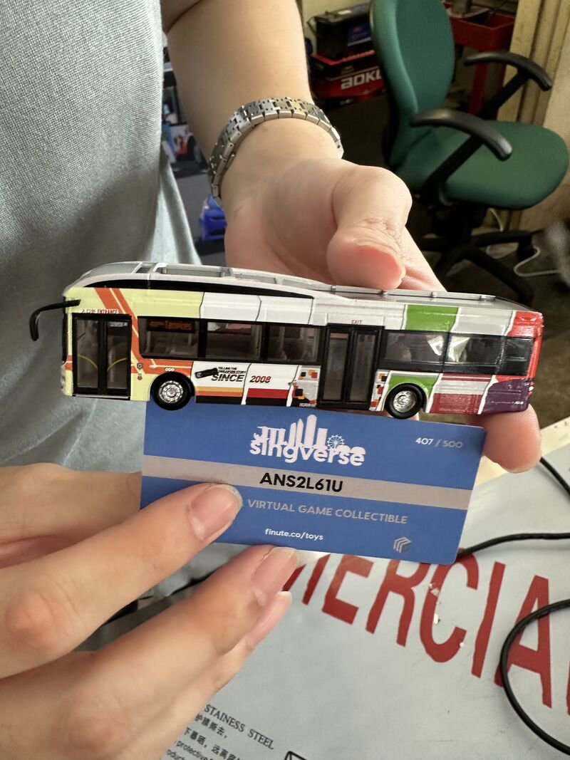 Singverse collectible bus model with redemption card